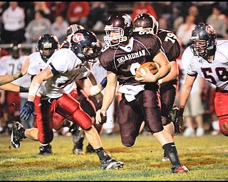 Boardman's (9) Rob Boyd  scrambes for yards against Austimtown during their game on Friday night. Photo Mark Stahl