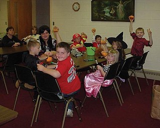 Students decorated pumpkins during their Halloween party at Sebring Trinity Lutheran Church.
                               