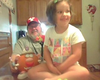 Mikayla Upright, 4, and her poppy, Bob Savon, Youngstown make a princess pumpkin together.
