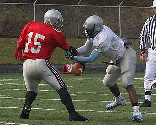 FOOTBALL - (8) Lilton Morris of East tries to strip the ball from (15) Carlos Colon during their game Saturday afternoon. - Special to The Vindicator/Nick Mays