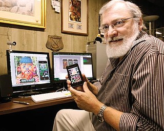 The Vindicator/Robert K. Yosay -----
Tom Antonishak, a Poland artist who developed an iPhone application.
---10282009