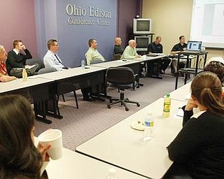 Pat Gaughan, YSU Business Community Laison , far right,conducts a meeting of The Garden Cub Angels Monday 10-19-09 at the Youngsotwn Business Incubator. wd lewis
