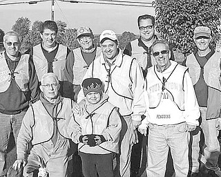 Special to The Vindicator
CLEANING UP: Canfield Rotarians filled dozens of garbage bags with trash found on the stretch of Route 46 between Shields and Kirk roads. Twice a year, club members spruce up this area as part of the Adopt-A-Highway program. The Canfield cleanup team is organized by Jim Petuch, the head of the Mahoning County Green Team. In front, from left, are Don Herriott, Anthony Nacarato and his son Joey, and Jim Petuch. In back, from left, are Tom Christoff, Sam Boak, Dale Bradshaw, John Morvay and Tom Walker. Taking the picture was Rotarian Mike Raulin.