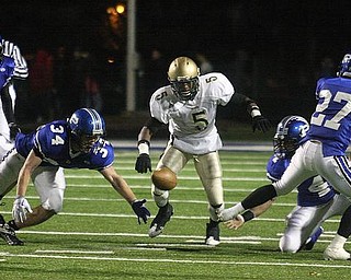 POLAND - (34) Luke Wollet makes a nice attempt at a pass intended for (5) Dominique Mitchell during their game Friday night in Poland. - Special to The Vindicator/Nick Mays