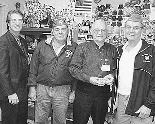 Special to The Vindicator
SHARING THE WEALTH: Funds to benefit needy veterans and their families were raised during a yearly reverse raffle and a Chinese auction sponsored by Catholic War Veterans Post 1292 of Youngstown at St. Mary Church in March. Mark Bell, director at the Veterans Administration Clinic on Belmont Avenue, at left, accepted the $1,200 donation during a meeting with, from left, Al Bisker, CWV Post 1292 trustee; Lovel Henderson Jr., volunteer service officer at the clinic; and Gary Barnes, commander of CWV Post 1292.