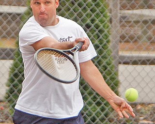 HE’S GOT IT: Frank Susor of Boardman took to the tennis courts in Boardman Park to enjoy spring temperatures in November. He and his playing partner Mike Phelps hit a few balls Monday. The high temperature for Sunday and Monday in the Mahoning Valley passed 70 degrees while the Saturday high was 66. The average high for the area for this time of the year is 51 to 52 degrees.