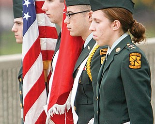 HONORING THE VETERANS: Members of Youngstown State University’s Reserve Officers’ Training Corps program served as honor guards at the university’s annual Veterans Day ceremony. Presenting the colors during Tuesday’s program are, from left, David Bruno of New Wilmington, Pa.; Brad Wheeler of Carrollton; Roger St. Julian of Cortland; and Kelli Phillips of Austintown.