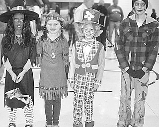 Special to The Vindicator
FALL FASHIONS: During a fall fair at Jackson Milton Elementary School, from left, Olivia Johnson, Korie Gross, Miranda Keck and Katie Matasy were chosen as the best dressed for fall haunting. Not pictured are Frank Yacucci, Dave and Shirley Pinney, Leah Condon and Steve Marshall, members of the Kiwanis Club of Western Mahoning County who judged the fall fashion event. Brian Higgins, executive director of Big Brothers Big Sisters, was a recent speaker at the Kiwanis Club, which meets at 6 p.m. Wednesdays at A La Cart in Canfield. The club recently conducted a cereal drive to benefit Operation Blessing in Canfield. For more information contact Barb Smith at (330) 502-1460.