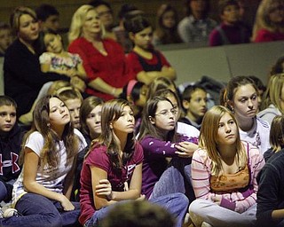 The Vindicator/Robert K. Yosay --- students listen intently as A salute to veterans at the Canfield Middle School students - interviewed veterans and told their stories. They also had a speaker who was once a student there as the main speaker YPD officer William Ward and former Marine 11/11/2009