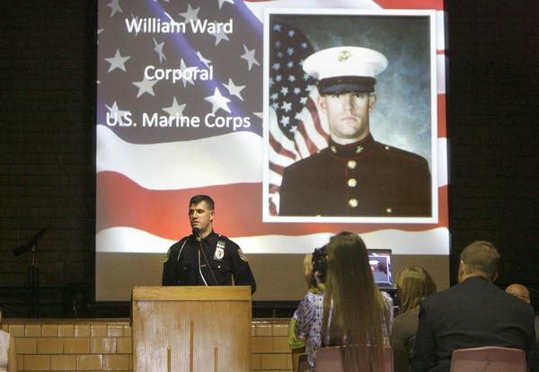 The Vindicator/Robert K. Yosay --- A A salute to veterans as the Canfield Middle School students  - interviewed  veterans and told their stories. They also had a speaker who was once a student there as the main speaker  YPD officer William Ward and former Marine 11/11/2009