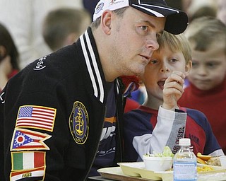 The Vindicator/Robert K. Yosay -----
Vets day program as parents and Veterans had lunch with the students at West Elementary in Boardman - Kindergarten student Christopher Yambar. tells his 'vet' dad Bob about lunch and the program
111120009