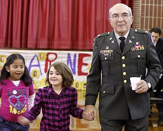 The Vindicator/Robert K. Yosay -----
Angelo Italiano of Youngstown wore his WW II uniform as his escorts for lunch and the program at West Elementary were Maria Higgs Sydney Reber first graders
111120009