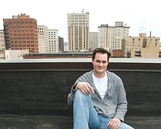 SKY’S THE LIMIT: Craig Zamary, founder of Green Energy TV, sits atop the Youngstown Business Incubator downtown.