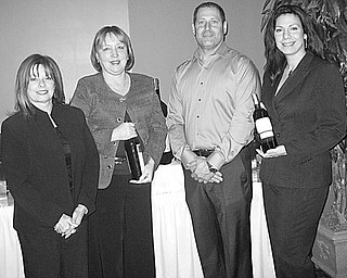 TASTE TEMPTING: Among those selecting the fine wines to be sampled by guests at the Holiday Charity Wine Taste on Nov. 22 are, from left, Pamela Ferguson, Southern Park Mall manager; Sheryl Raulin, mall marketing director; Less Horvath, owner of Rachel’s Catering; and Debra Grim, of Special Event Coordinators Inc.