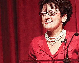 IN THE RED: Dr. Kathie Nelson gives tips on how to reduce stress at Humility of Mary Health Partners Red Dress event. The event, which raises awareness about women and heart disease, was Sunday afternoon at Antone’s Banquet Center.