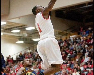 The Vindicator/Geoffrey Hauschild
YSU's DeAndre Mays soars toward the basket scoring two points for the Penguins during the first half at Beeghly Center on Wednesday afternoon.