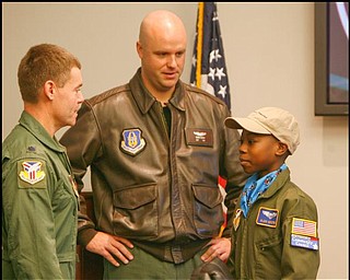 The Vindicator/Robert K. Yosay -----

Meeting the colonel  -  Alan Hinton 11 of Youngstown  talks over strategery with Colonel Craig Peters and Capt Brian Hodor ( the pilot of the C-130 and Alans Mentor ) - Alan was pilot for a day at the Youngstown Airbase - 11182009
