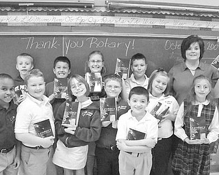 Special to The Vindicator
new books: How do you spell t-h-a-n-k y-o-u? Students in Mrs. Kelly Kroynovich’s third-grade class at St. Patrick School in Hubbard will know how thanks to the Hubbard Rotary Club. Each year the club presents children in the new third-grade class with new dictionaries for them to keep so they can excel in their schoolwork.