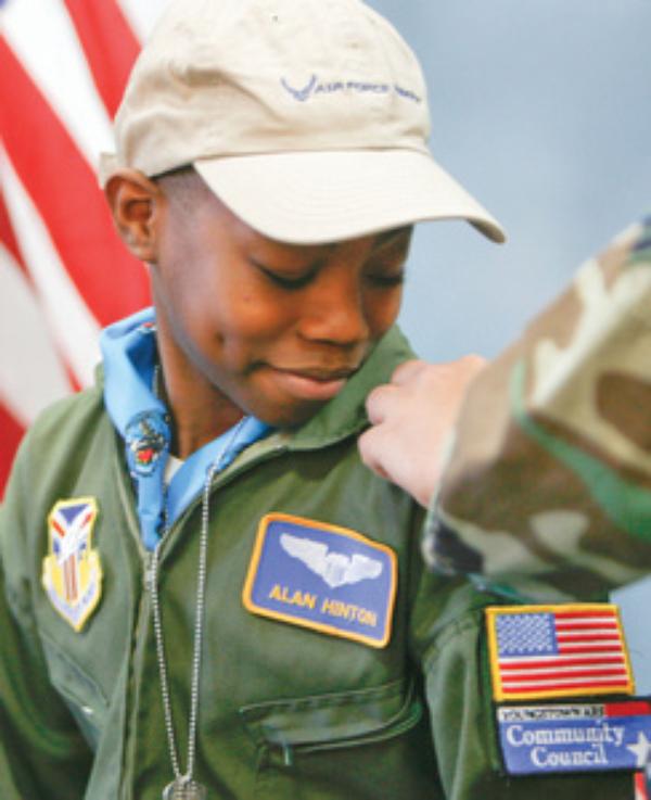 REPORTING FOR DUTY: Alan, of Youngstown, gets his bars as an honorary Air Force Reserve second lieutenant. The sixth-grader at Youngstown Community School suffers from sickle cell anemia. 