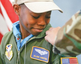 REPORTING FOR DUTY: Alan, of Youngstown, gets his bars as an honorary Air Force Reserve second lieutenant. The sixth-grader at Youngstown Community School suffers from sickle cell anemia.