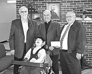 Special to The Vindicator
JOYOUS MOMENT: East Palestine Knights of Columbus recently made a donation of $1,400 to the Columbiana County Board of Developmental Disabilities. Sharing the happy moment with Zach Beverly, a student at the Robert Bycroft School in Lisbon, are, standing from left, Gene Hoffman of the K of C; the Rev. Dan Cipar of Our Lady of Lourdes in East Palestine; and William Devon, superintendent of the CCBDD.