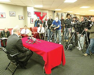 MEETS THE PRESS: Ron Strollo, YSU’s athletic director, talks to reporters after Jon Heacock’s resignation as football coach. Strollo said Monday he is immediately launching a national search for a successor. 