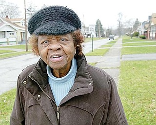 HOLDING ON: Ruby Yates, 85, has lived in the same Idora neighborhood on Youngstown’s South Side for almost 40 years. While the neighborhood used to be a gem of the Mahoning Valley, the area has regressed, she said. In recent years, however, some positive change has occurred, she says.