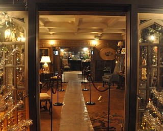 A view of The Arms Family Museum's Library, decorated for Christmas, from the solarium.