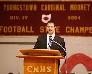 The Vindicator/Robert K. Yosay -----
Kyle McCarthy Class of 2004 State Champions Team gives them support as he spoke at the -pep rally f- behind him is the banner his class brought home a state champion- 1232009