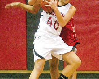 William D. Lewis/The Vindicator Desiree DeFrank of Girard tries to keep the ball from fitch's Erica Braxton during Thursday action at Girard.