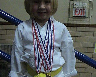 Julianna Hornikel of Girard won three medals in her very first karate tournament.