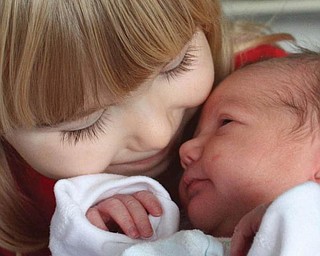 Big sister Abby Ruggles meets her baby sister Macy for the first time on November 22. They are the daughters of Steve and Renee Ruggles of Austintown.