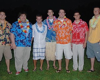 Friends and family did not let the tough economic time prevent them from returning to their hometown from all over the country to celebrate the wedding of Ryan and Megan Maxwell. Seen in this picture at the rehearsal dinner luau, from left, are Russell Dawson of Florida, Steve Safran of South Carolina) David Maxwell of North Lima, Joe Rettig of Dayton, Ryan Maxwell of Kent, Danny McCooey of Texas and Alex Duncan of East Palestine.