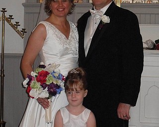 Kerry Kosmo and Jeff Bullock (of Athens) were married Oct. 9 at St. James Meeting House in Boardman Township Park with McKenna Sweeney, 4, of Boardman as flowergirl.