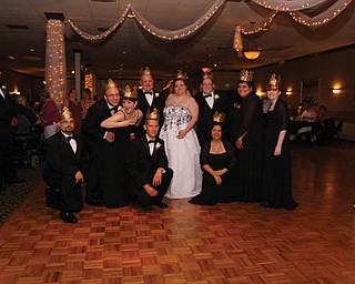 Lisa and Mike Kuty say 2009 was a great year ? they got married. Kneeling, from left, are Ken Payne of Austintown, Ted Oltmann of Hubbard and Lyn Stewart of Warren. Standing, from left, are Nick Dominick of Struthers, Julie Dominick of Struthers, Mike and Lisa of Girard, Bill Sicafuse of M Murray, Pa., Amanda Brewer of Hubbard and Theresa Honaker of Girard.
