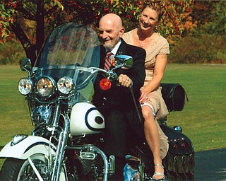 Tom and Chris Christmas were joined by friends and family, all of whom were riding their motorcycles to the wedding reception on Oct. 10.