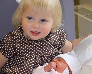 Big sister Payton Zwingler meets her baby sister Parker for the first time on June 3. They are the daughters of Chad and Alyson Zwingler of Columbiana.