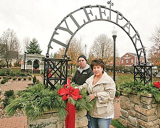 SPRUCING UP: Deborah and Harry Shields adds finishing touches on decorations at Tylee Park in Hubbard. The couple spearheaded a campaign to clean up the park.
