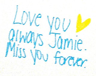 MISS YOU: A message on a poster board for Jamie Serich at the memorial mass Monday. Mourners were asked to write messages and express their feelings on the boards, on display at the back of the chapel in Cardinal Mooney High School.