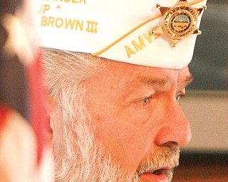 John P Brown III, former national commander, addresses the veterans who attended Pearl Harbor Day services at the Veterans Cabin at the Canfield Fairgrounds.
