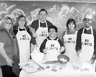 Special to The Vindicator
MADE TO ORDER: A Christmas cookie sale is planned as fundraiser for Turning Point Day Habilitations No Limits program. Orders will be accepted until Friday for the following cookies: frosted sugar cookies, gingerbread, chocolate chip, and reindeer fudge for $5 a dozen; and pizzelles, peppermint chocolate, buckeyes and kaleidoscope cookies for $4 a dozen. Orders may be dropped off, faxed to (330) 792-8025 or phoned to (330) 792-8024. Checks should be payable to turning Point Residential Inc. Prepared to bake cookies to fill the orders in time for pickup on Dec. 21 are, from left, Kathy Phillips and Mary Kay Tusinac, owners; Nathan Sandusky; Nicole Ginnetti; Lesley Phillips, director of No Limits; and Ellis Thomas. For additional information call (330) 881-5038.