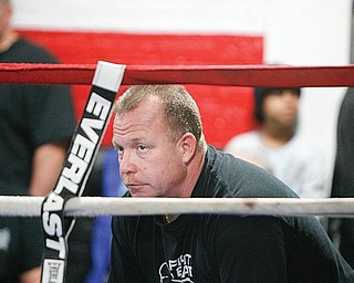WATCHFUL EYE: Jack Loew watches as Pavlik spars during an open workout at Loew’s South Side Boxing Club on Market Street.