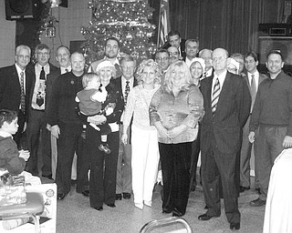 Special to The Vindicator
FOR THE CHILDREN: Youngstown Lions Club recently hosted its 89th consecutive Christmas party for the visually impaired and special needs children from Youngstown schools. The youngsters were treated to a turkey luncheon and Christmas carols. Santa Claus was on hand to distribute 120 gifts, which were requested by the children and provided by the Lions. The children also received scarves and gloves purchased with funds donated by RE/MAX Valley Real Estate. Special guests included Wendy Webb, superintendent of the Youngstown City Schools; teachers; mentors; and a guest who has attended the party each year for more than 70 years. In addition to hosting the party, the Lions Club raised funds at an annual Turtle Derby and provided more than $20,000 this past year for those in need.