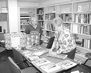 WRAPPERS: Wrapping presents at the Family Practice Center at Northside Medical Center are employees Kathi Wyllie, left, and Dorothy Andrews, R.N. This year, the center has early presents for pediatric patients. The ones who have an office visit to be immunized any time in December will receive a new toy that was generously donated by either an NMC employee, physician, day care provider or church. Nearly 200 toys were donated. “The Family Practice Center came up with the idea based on low immunization rates in Ohio,” said Lisa Weiss, M.D., director of the center.
Special to The Vindicator