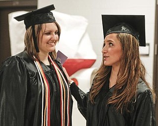 The Vindicator/Lisa-Ann Ishihara-- Bachelor of Arts grads Kristen Catullo and Sarah Cammarata at YSU Beeghly Center Sunday December 13, 2009