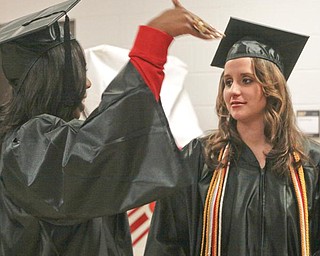 The Vindicator/Lisa-Ann Ishihara-- Bachelor of Arts grads Leslie Rogers and Tiffany Rathfon, both of Struthers, at YSU Beeghly Center Sunday December 13, 2009