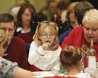 The Vindicator/Lisa-Ann Ishihara-- Rory Schuler (5) of Boardman takes a big bite during vilija (traditional Slovak Christmas Eve meal)
at St. Matthias Church Father Snock Parish Center hosted by American Slovak Cultural Association Sunday December 13, 2009