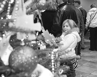 The Vindicator/Lisa-Ann Ishihara--
Sabrina Bliss (10) of Austintown looks at the Rich Center tree at Fellows riverside gardens
Sunday December 13, 2009