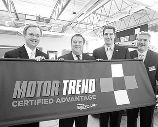 CONTINUED EXCELLENCE: From left, state Rep. Ron Gerberry of Austintown, D-59th; Chuck Eddy, of Bob and Chuck Eddy Chrysler Dodge Jeep; U.S. Rep. Tim Ryan of Niles, D-17th; and Joe Negley, vice president of sales and marketing for EasyCare, were on hand at Eddy’s Austintown dealership to discuss the dealership’s designation as a Motor Trend Certified Advantage dealership. EasyCare trains dealership employees to meet the requirements of an advantage dealership.