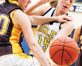 United's Ruth Prosko (30) and Chelsea Laughlin (15) manage to get South Range's Ellie Stoffer (40) to drop the ball during the 2nd period Monday night.